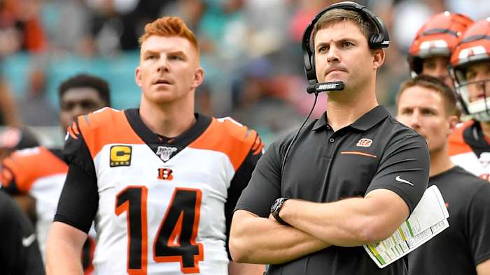 Andy Dalton and coach Zac Taylor look on the field during their loss to the Miami Dolphins.